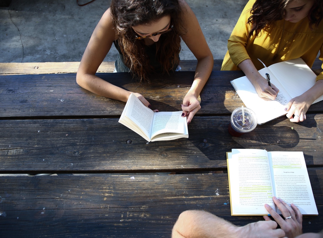 Girls studying at a picnic table